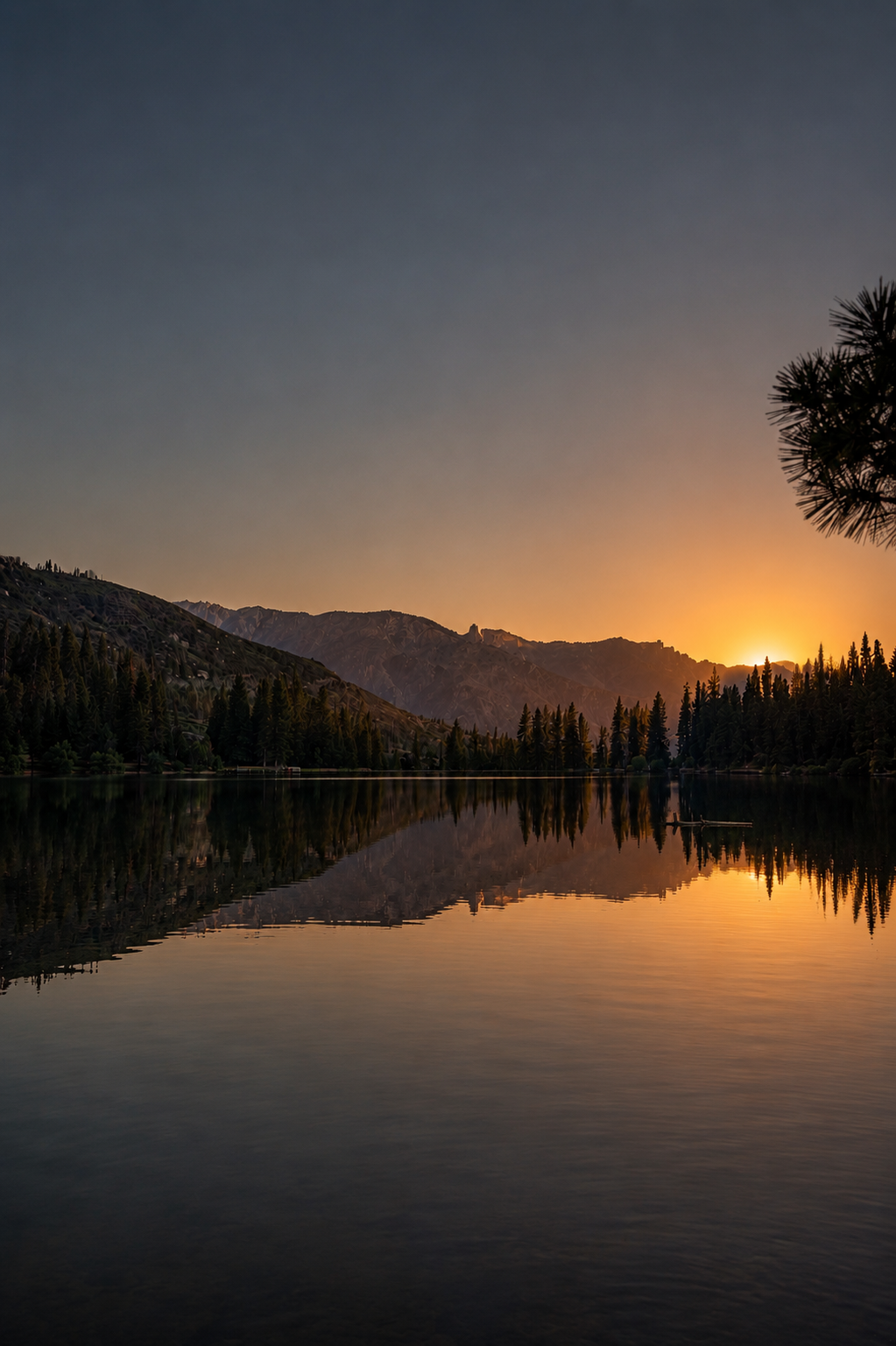Mountain lake at sunset with perfect mirror reflection